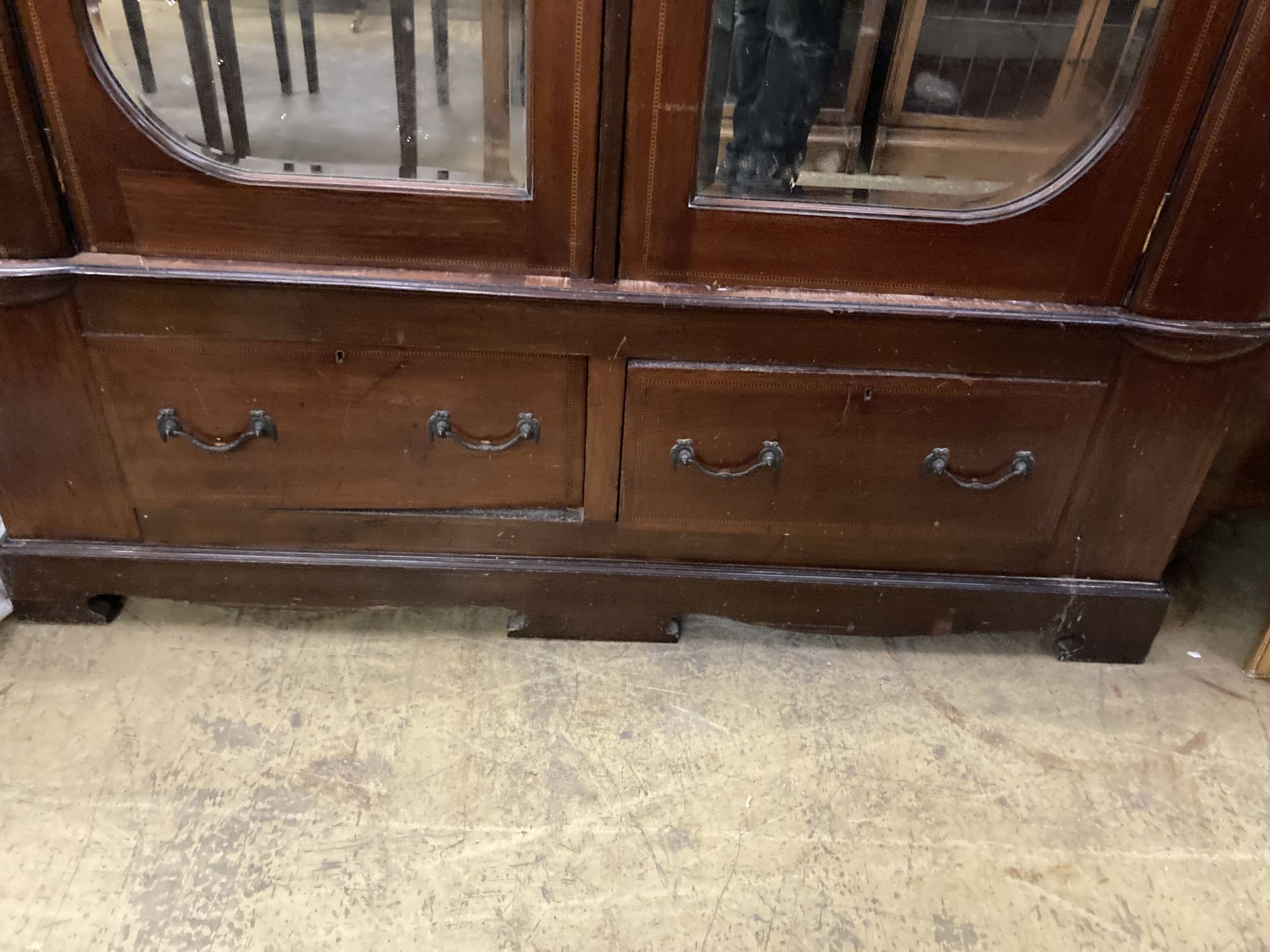 A Victorian inlaid mahogany mirrored wardrobe of two doors, length 146cm, depth 48cm, height 206cm